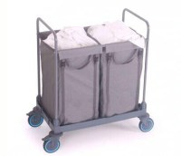 Uluslararası standartlarda üretilmiş, 2x125 litrelik çift torba haznesine ve kapalı estetik kapak bloğuna sahip, alt kısmında çarpmalara dayanıklı dairesel tamponları bulunan gri renkli profesyonel çamaşır toplama arabasının stüdyo çekimi görseli.